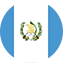 Flag of Guatemala with vertical blue-white-blue stripes and a national emblem featuring a quetzal bird, scroll, and crossed rifles and swords.